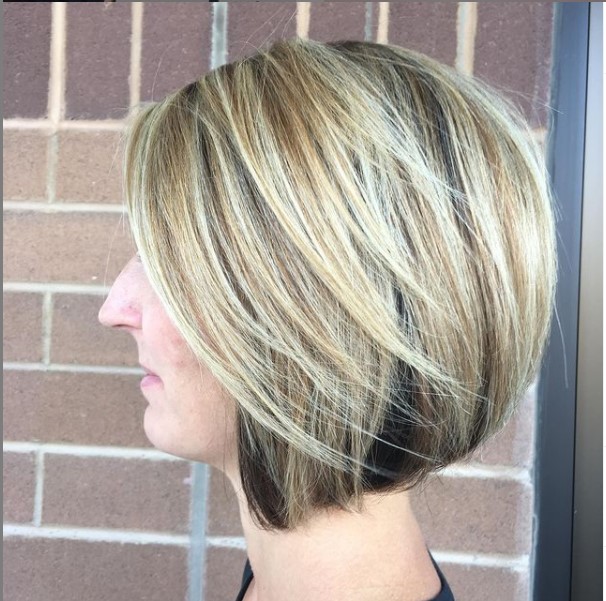 True Colours Hair Studio Calgary woman's haircut from the side, blonde highlights, graduated bob